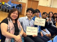 SEK Debate Team posing for a photo with Assistant Principal Miss Kam